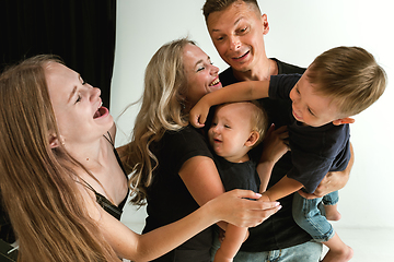 Image showing Young family spending time together and smiling