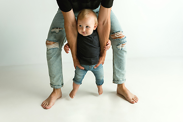 Image showing Happy father holding adorable little son and smiling