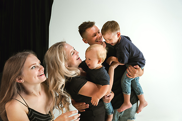 Image showing Young family spending time together and smiling