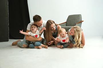 Image showing Young family spending time together and smiling