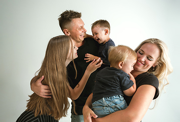 Image showing Young family spending time together and smiling