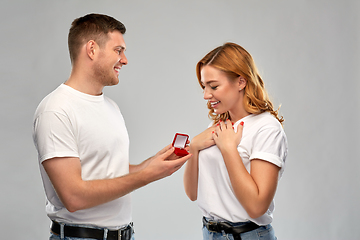 Image showing man giving woman engagement ring on valentines day