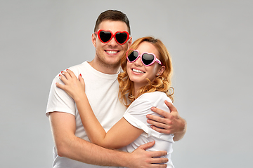 Image showing happy couple in white t-shirts and sunglasses