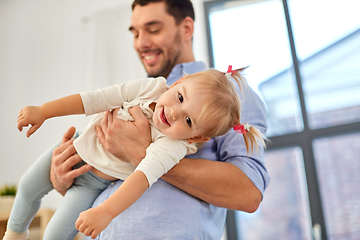 Image showing father with little baby daughter at home