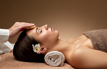 Image showing close up of woman having face massage in spa