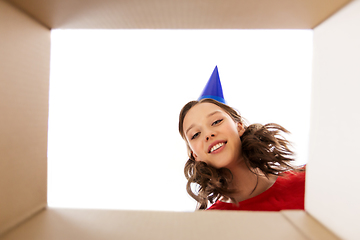 Image showing happy young woman looking into open birthday gift