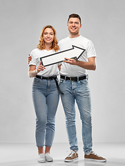 Image showing happy couple in white t-shirts with arrow to right