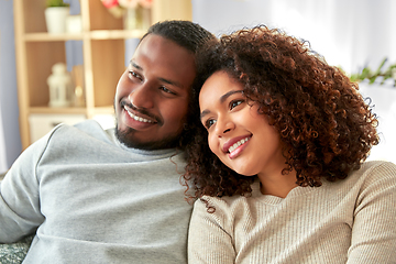 Image showing happy african american couple hugging at home