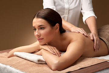 Image showing woman lying and having back massage at spa