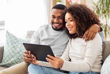 Image showing african american couple with tablet pc at home