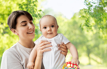 Image showing happy young mother holding little baby daughter