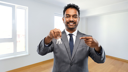 Image showing indian man realtor with home keys at new apartment