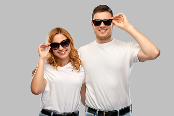 Image showing happy couple in white t-shirts and sunglasses