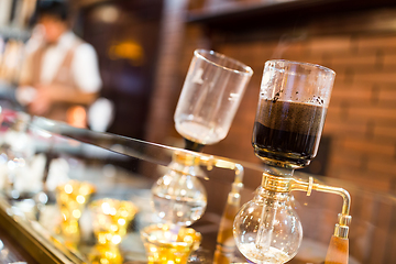 Image showing Coffee siphon in use