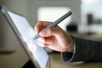 Image showing Woman using pen on tablet pc