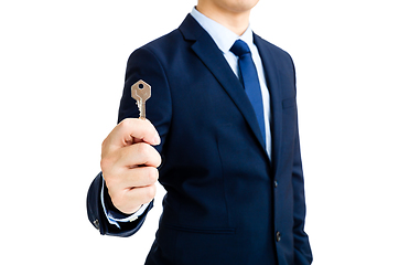 Image showing Businessman showing a key