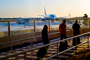 Image showing Boarding plane at airport