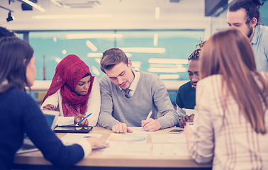 Image showing Multiethnic startup business team having meeting