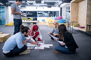 Image showing black muslim woman having meeting with Multiethnic  startup busi