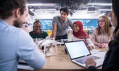 Image showing multiethnic business team learning about drone technology