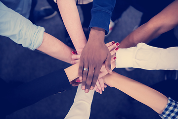 Image showing multiethnic Group of young business people celebrating success