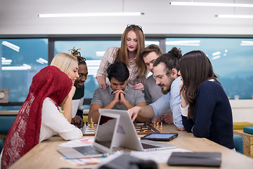 Image showing multiethnic group of business people playing chess