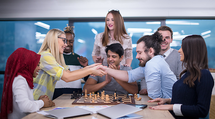 Image showing multiethnic group of business people playing chess