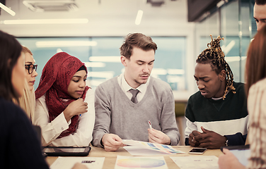 Image showing Multiethnic startup business team having meeting