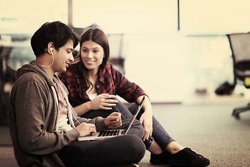 Image showing software developers couple working on the floor