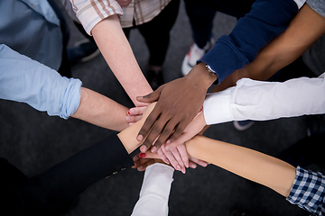 Image showing multiethnic Group of young business people celebrating success