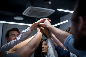 Image showing multiethnic Group of young business people celebrating success