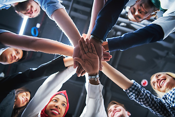 Image showing multiethnic Group of young business people celebrating success