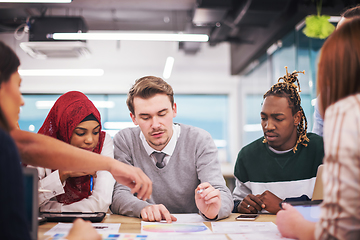 Image showing Multiethnic startup business team having meeting