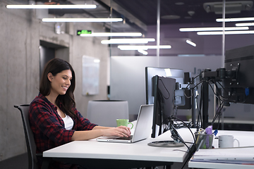 Image showing female software developer using laptop computer