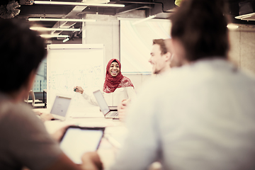 Image showing Muslim businesswoman giving presentations at office