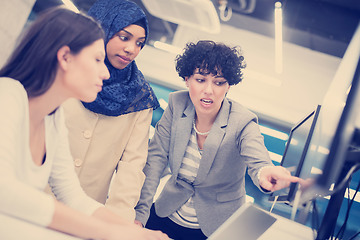 Image showing multiethnics team of software developers working together