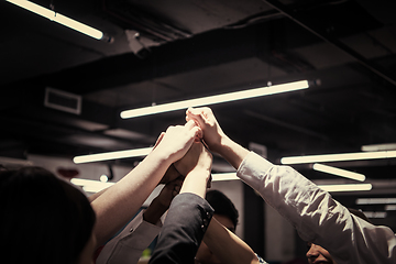 Image showing multiethnic Group of young business people celebrating success