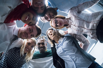 Image showing multiethnic Group of young business people celebrating success