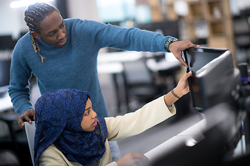 Image showing young black muslim female software developer at work