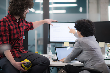 Image showing software developers couple writing programming code