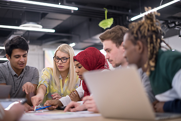 Image showing Multiethnic startup business team having meeting