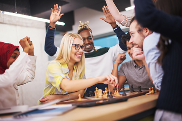 Image showing multiethnic group of business people playing chess