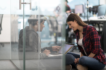 Image showing software developers couple working on the floor