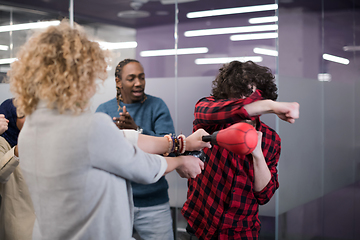 Image showing multiethnics business team boxing at office