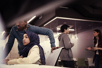 Image showing young black muslim female software developer at work