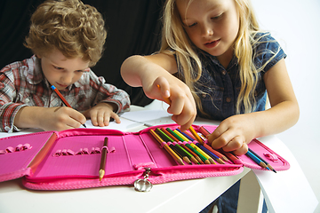 Image showing Boy and girl preparing for school after a long summer break. Back to school.