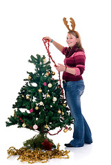 Image showing Happy girl decorating Christmas tree