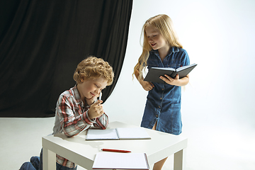 Image showing Boy and girl preparing for school after a long summer break. Back to school.