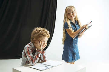 Image showing Boy and girl preparing for school after a long summer break. Back to school.