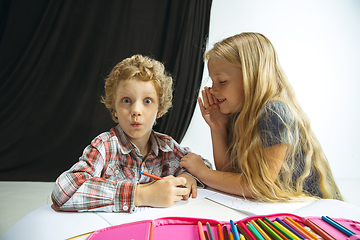 Image showing Boy and girl preparing for school after a long summer break. Back to school.